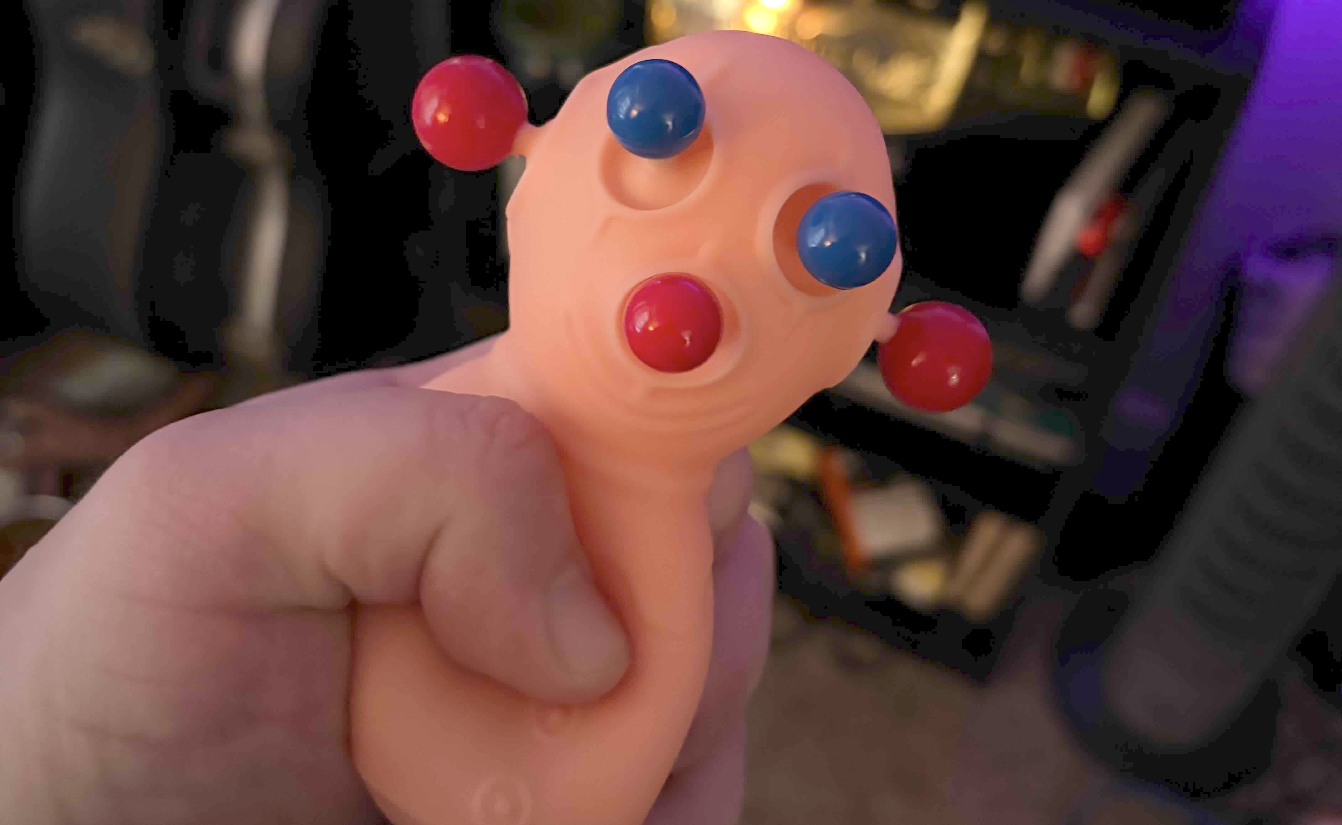 image of someone squeezing a panic pete stress toy